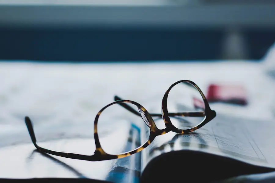 Glasses sitting on book | Capital Surgical Back Surgery Boise